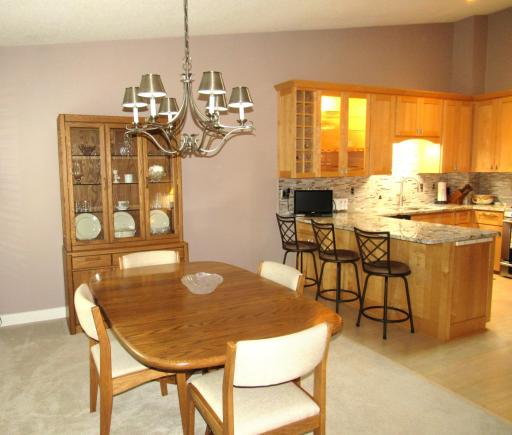 Spacious dining room with updated lighting.