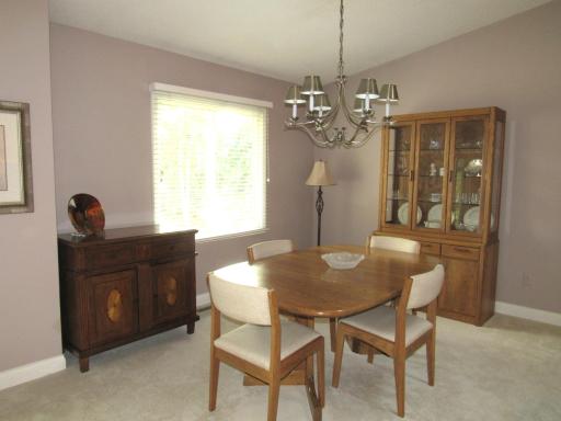 Another view of the dining room. All the window treatments stay with the home and they are very nice.