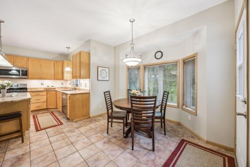 An open-concept dining and kitchen space creates an ideal setting for entertaining guests and everyday living.