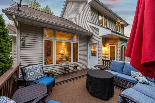 Spacious sitting area on the deck just off of the dining/kitchen area - wonderful for hosting BBQ's or having your morning coffee!