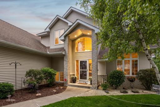 A dramatic two-story entryway welcomes you with timeless elegance.