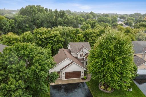 Enjoy peace and privacy on a beautifully wooded lot spanning nearly 3/4 of an acre.