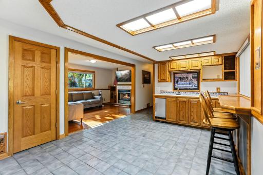 Wet bar features ice maker. Ample space for game table