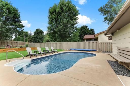 The backyard is stunning and all pool mechanicals are enclosed in the garage bump out