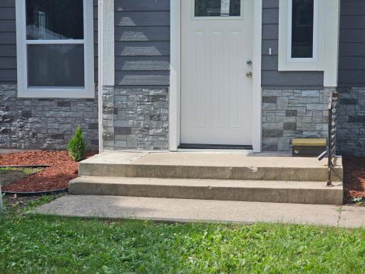 Front entrance. New siding. New windows. Spectacular.