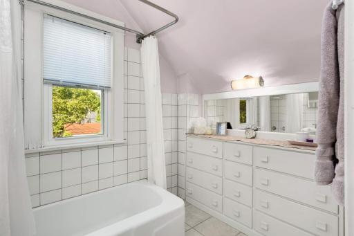 The bath also offers tons of storage and a custom mirror.