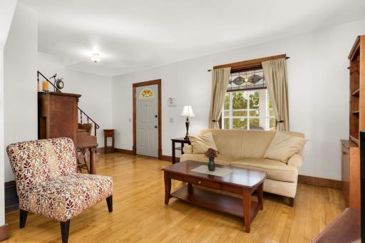 The first thing you'll notice are the lustrous original maple floors.