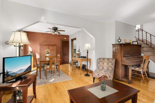 Fresh paint and glowing floors give these spaces a warm and cozy vibe. The door at the back of the room is a large coat/storage closet.