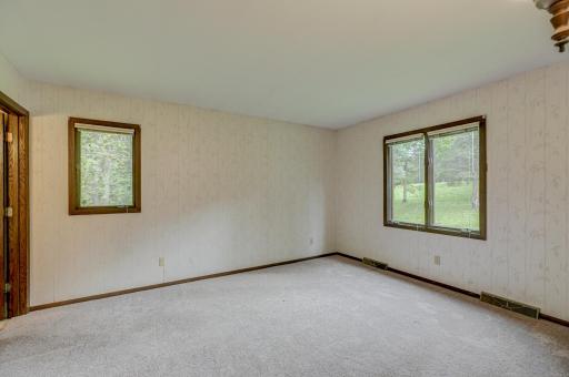 The spacious primary suite is conveniently located on the upper level for privacy and comfort