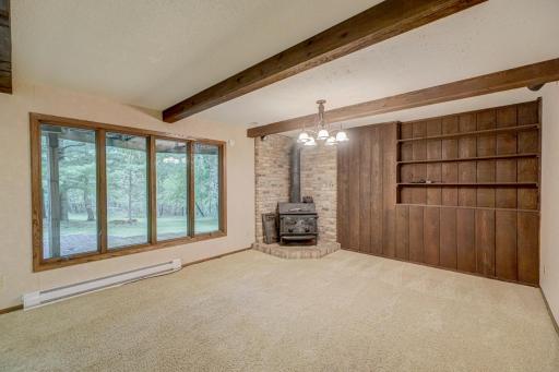 Relax by the wood stove and take in the peaceful, picturesque backyard scenery