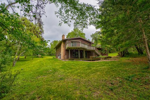 Experience the privacy and tranquility this beautiful acreage property provides