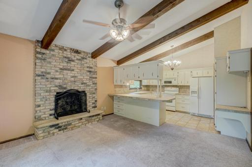 Dine next to a gorgeous brick fireplace, creating a cozy and welcoming atmosphere