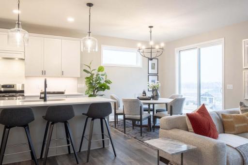 This home offers seamless living with an open flow between the kitchen, dining, & fam room. This layout enhances function ,making it ideal for both everyday living & entertaining. Photos are from previously built home; options & features may vary.