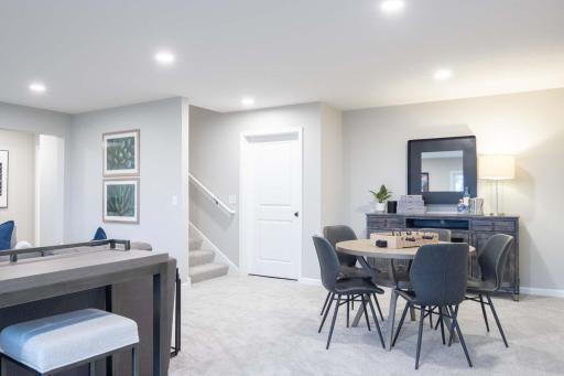 This beautifully finished lower level offers a versatile living space, perfect for additional family gatherings, guests, or relaxation. Photos are from previously built home; options and features may vary.