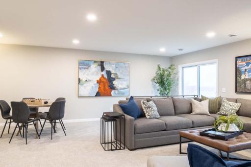 Whether you're entertaining, hosting overnight guests, or simply enjoying some quiet time, the finished lower level space offers endless possibilities to suit your lifestyle. Photos are from previously built home; options and features may vary.