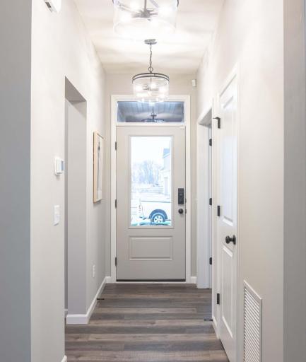 Step into this beautifully designed home, where an inviting foyer welcomes you with warmth and elegance. Photos are from previously built home; options and features may vary.