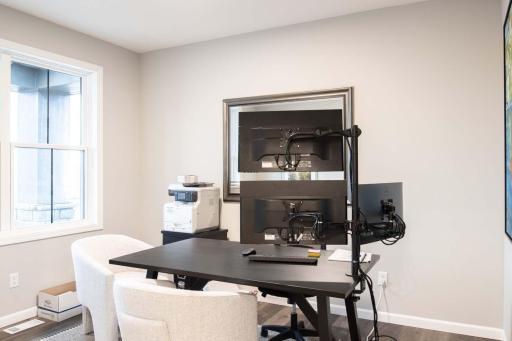 This home offers versatile living spaces, starting with a well-appointed front office—perfect for working from home, studying, or creating a quiet retreat. Photos are from previously built home; options and features may vary.
