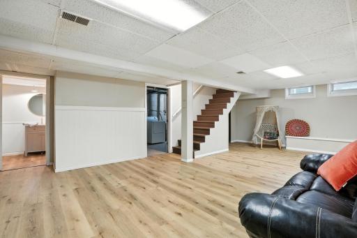 Lower level recreation room with luxury vinyl flooring