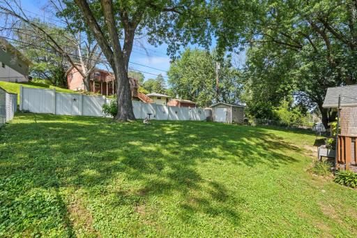 Fabulous back yard all fenced in. Shaded with a Maple Tree. Shed included for extra gardening items. All fenced in with a composite deck.