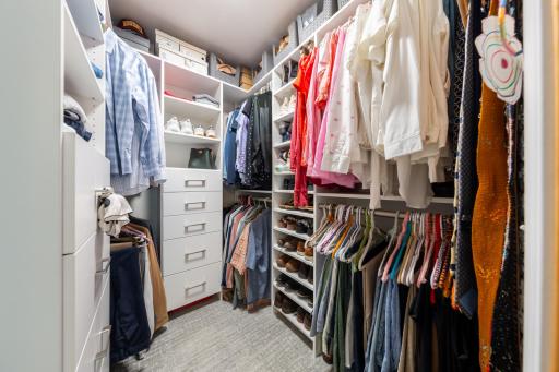 Primary Walk-in Closet with Custom Built in Shelving & Drawers