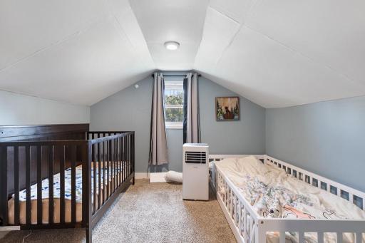 Upstairs find 2 additional charming bedroom spaces