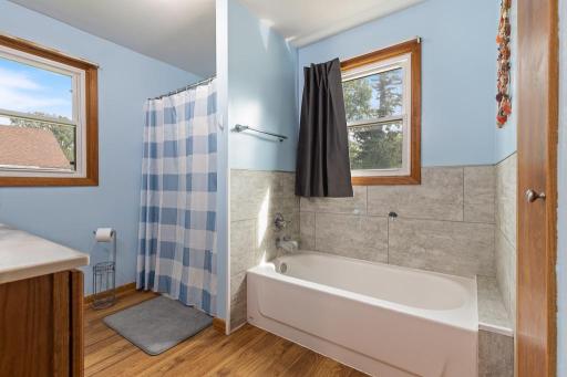 Nicely updated full bathroom with a separate tub and step-in shower for those busy days