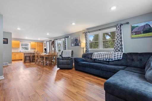 View of the living room, dining space, and kitchen