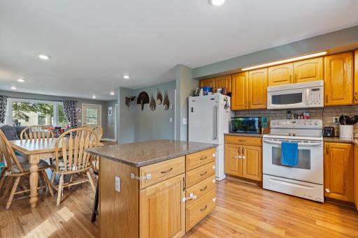 The center island not only provides a casual seating area, but doubles as great additional storage