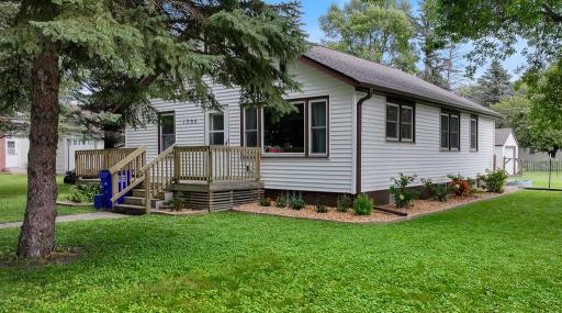 The exterior has fresh landscaping with mulch and shrubs adding to the curb appeal