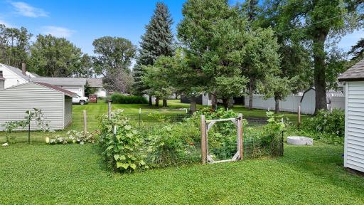 Check out the fully fenced in garden area! Ready to grow all of your seasonal favorites