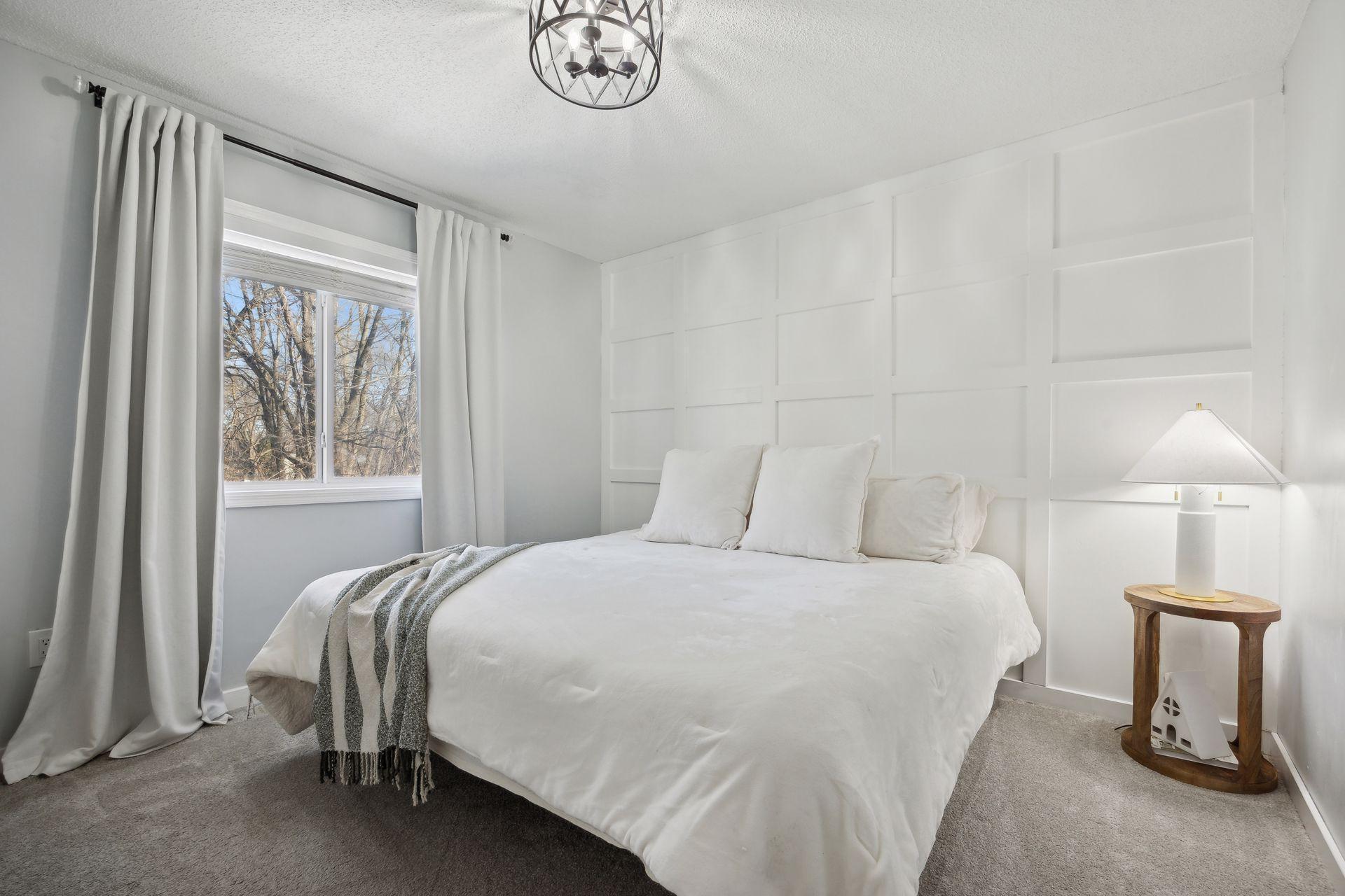 12x11 Upper Level Bedroom #1 with updated styling, accent wall, fresh paint, and white trim. East-facing windows