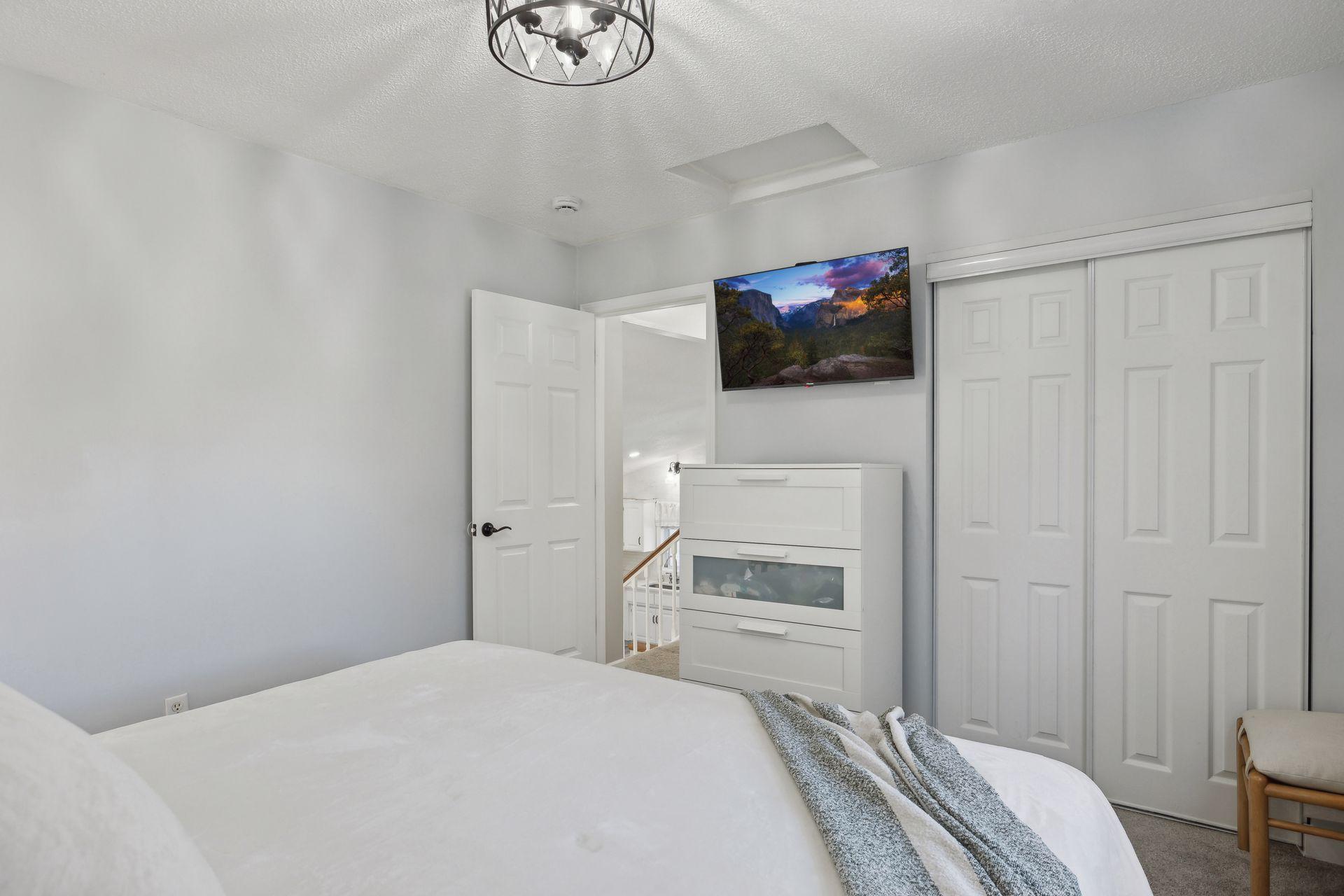 12x11 Upper Level Bedroom #1 with updated styling, accent wall, fresh paint, and white trim. East-facing windows