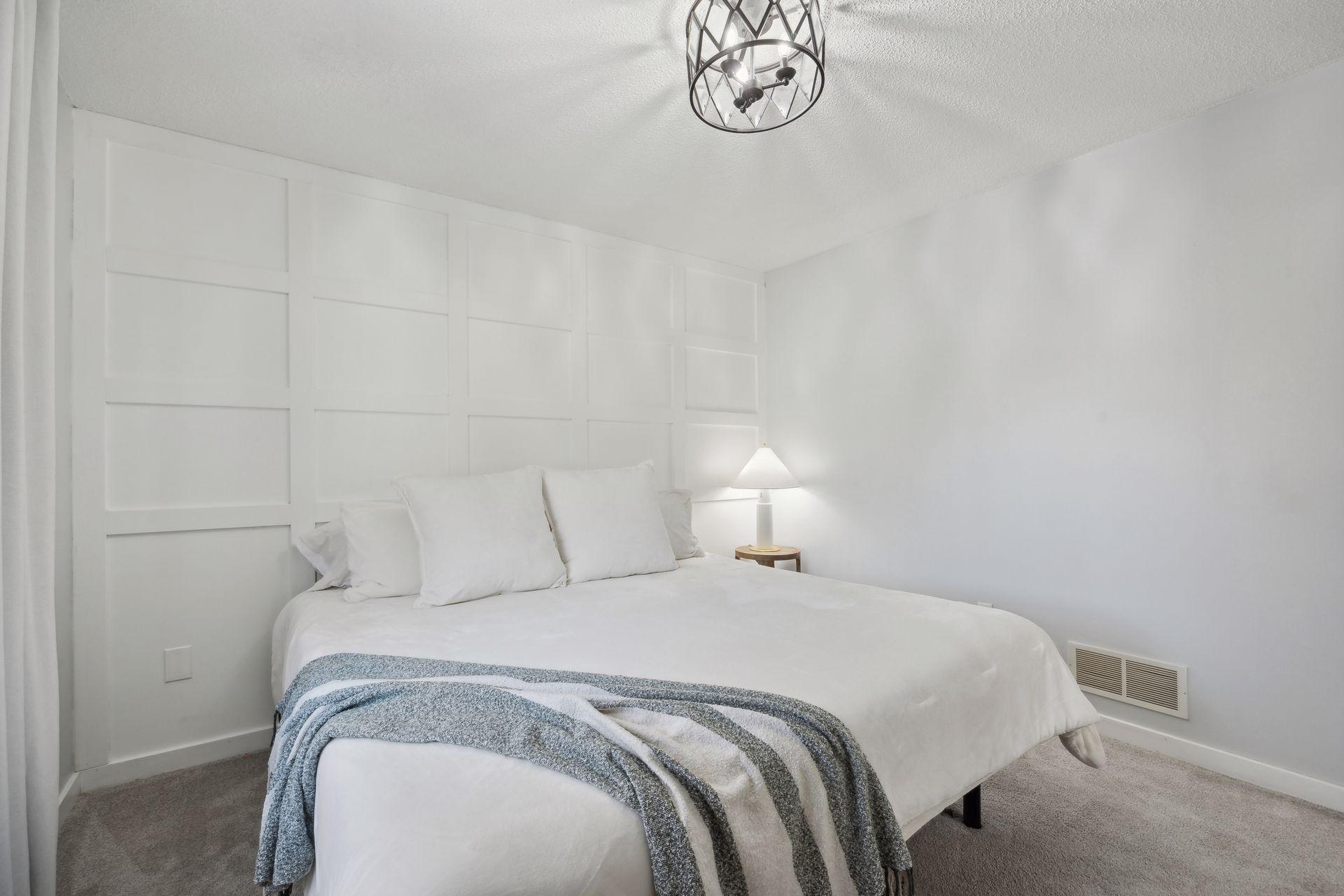 12x11 Upper Level Bedroom #1 with updated styling, accent wall, fresh paint, and white trim. East-facing windows