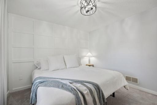 12x11 Upper Level Bedroom #1 with updated styling, accent wall, fresh paint, and white trim. East-facing windows