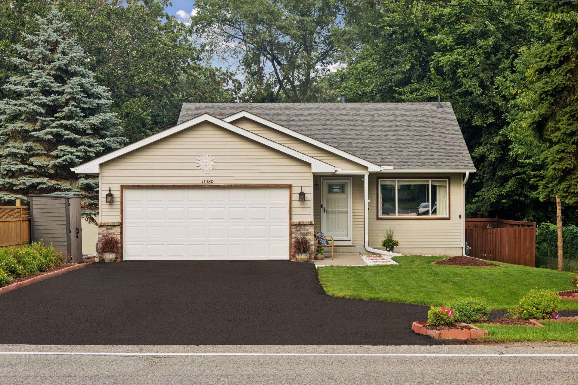 11380 West River Road, 2 Bedrooms, 2 bathrooms, 1400 Finished Square Feet, a 2 Car attached Garage, and a fully fenced-in Back yard.