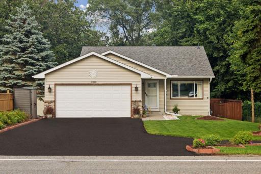 11380 West River Road, 2 Bedrooms, 2 bathrooms, 1400 Finished Square Feet, a 2 Car attached Garage, and a fully fenced-in Back yard.
