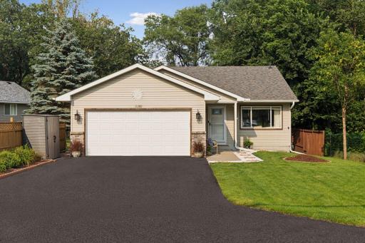 11380 West River Road, 2 Bedrooms, 2 bathrooms, 1400 Finished Square Feet, a 2 Car attached Garage, and a fully fenced-in Back yard.