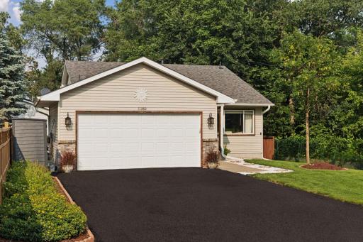 11380 West River Road, 2 Bedrooms, 2 bathrooms, 1400 Finished Square Feet, a 2 Car attached Garage, and a fully fenced-in Back yard.