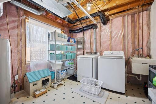 13x11 Laundry room/Mechanical room with extra storage.