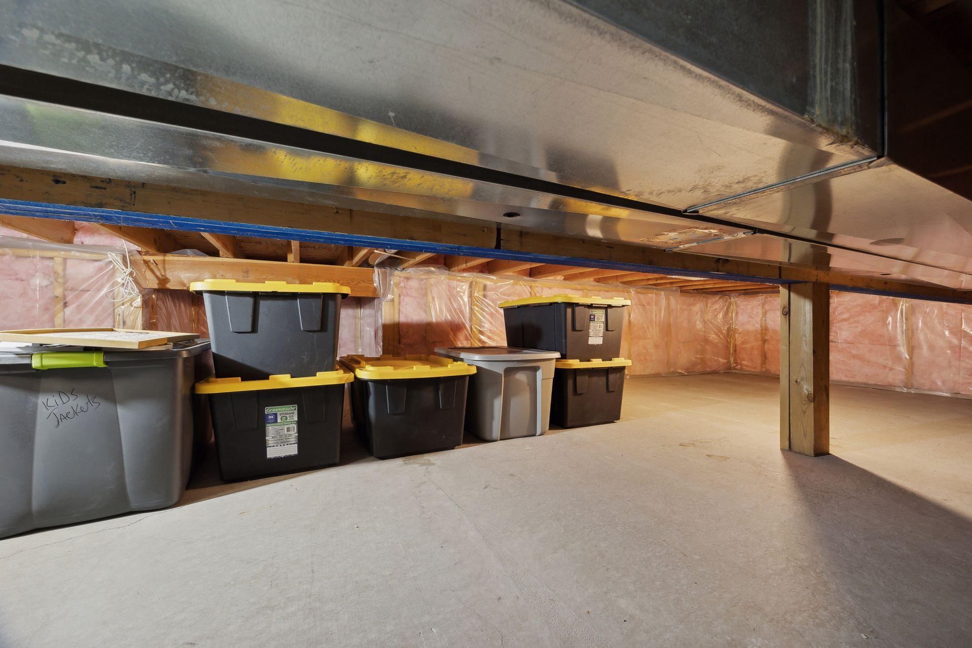 Crawlspace under the living room and kitchen for extra storage with new updated insulation.
