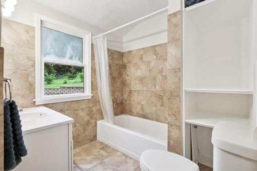 Full main floor bathroom that is fully tiled