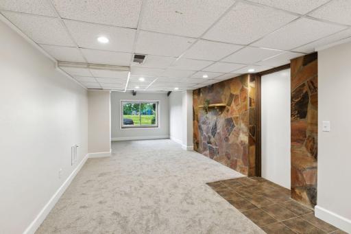Enjoy the lookout lower level family room with new carpet