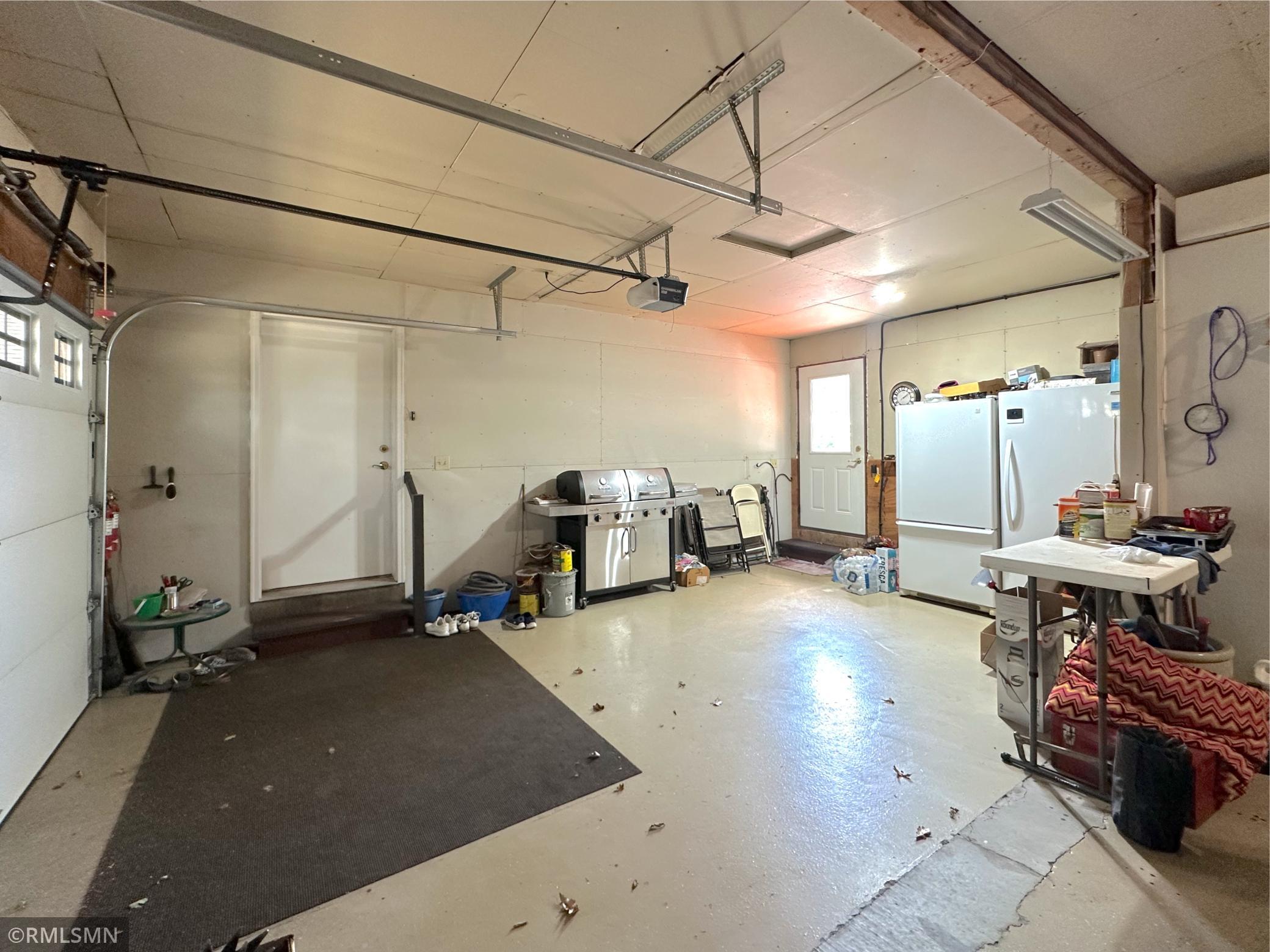 Spacious double garage offering plenty of room for vehicles & storage with easy access to the home & lakeside.