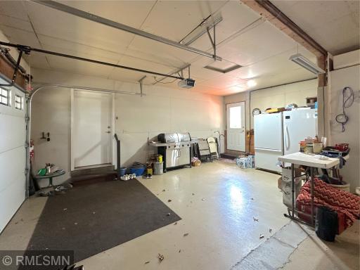 Spacious double garage offering plenty of room for vehicles & storage with easy access to the home & lakeside.