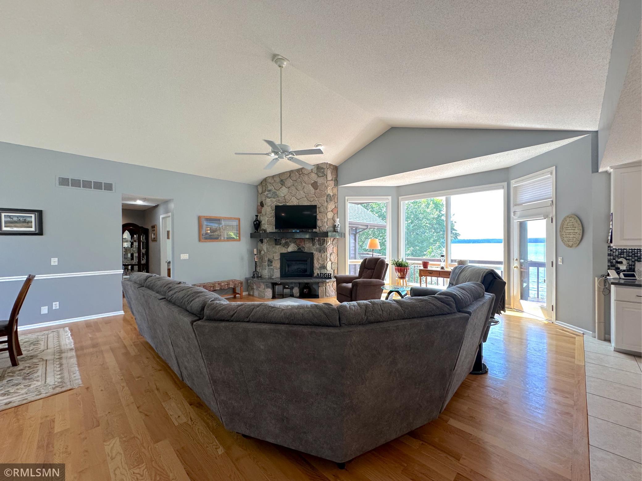 Relax in the sun-filled living room, where a wall of windows frames sweeping views of the Clearwater Lake.