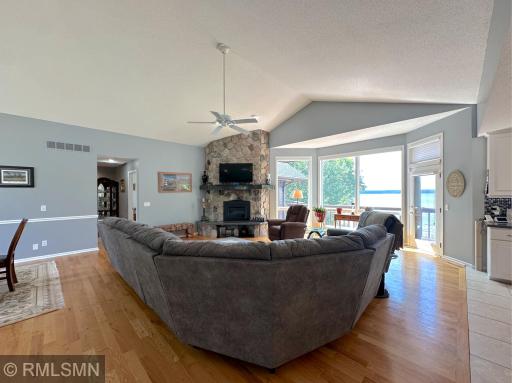Relax in the sun-filled living room, where a wall of windows frames sweeping views of the Clearwater Lake.