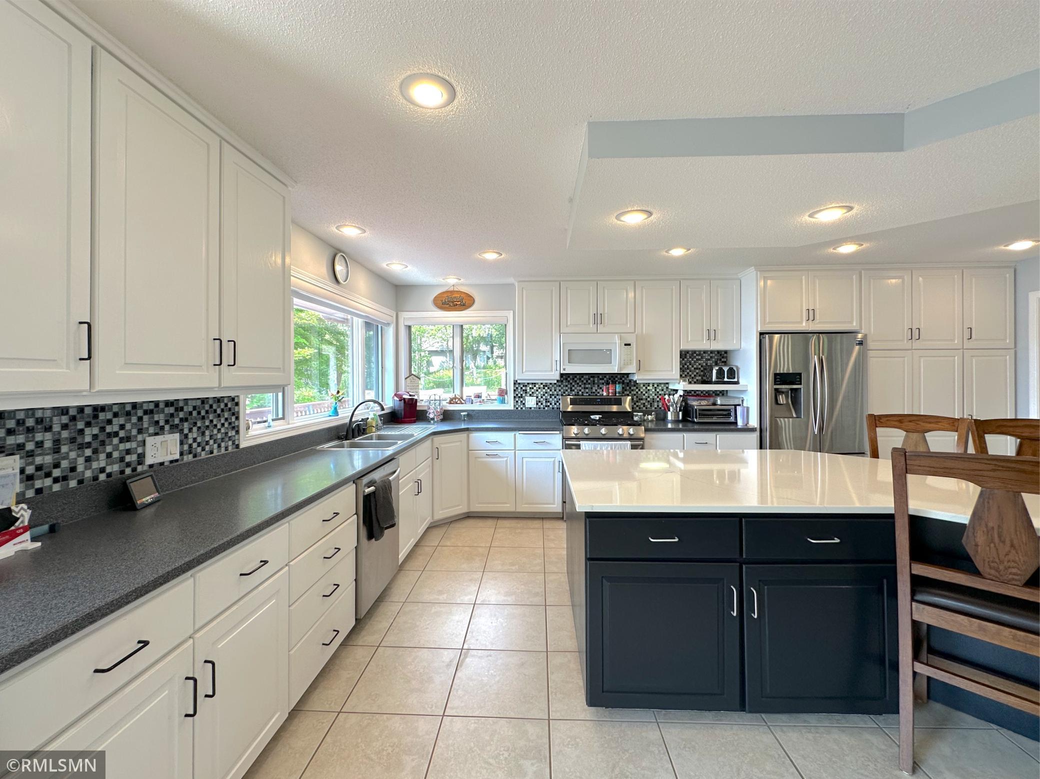 This spacious kitchen is designed for everyday living & entertaining, featuring a large center island with seating.