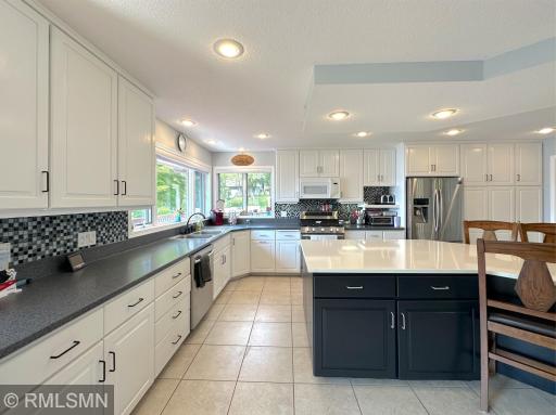 This spacious kitchen is designed for everyday living & entertaining, featuring a large center island with seating.