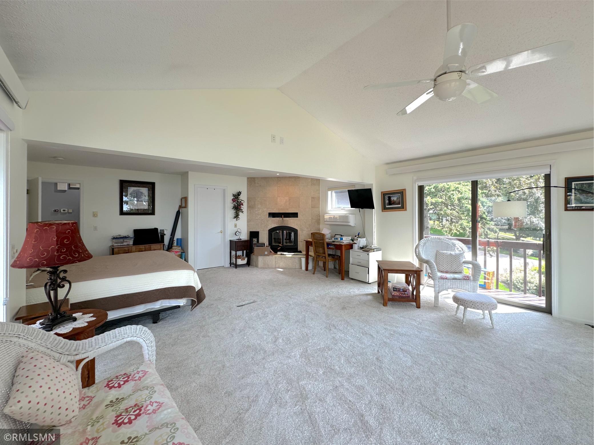 With plenty of space to unwind, this primary suite retreat blends comfort, light, and scenery in perfect harmony.