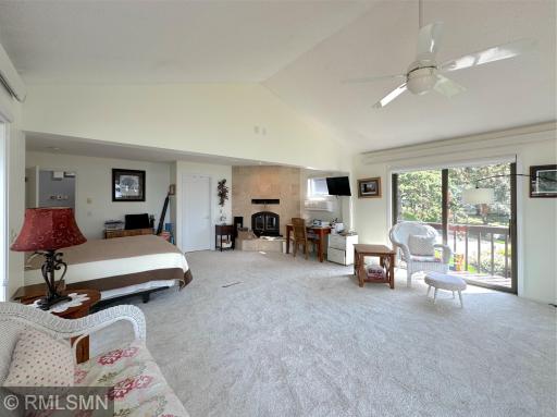 With plenty of space to unwind, this primary suite retreat blends comfort, light, and scenery in perfect harmony.